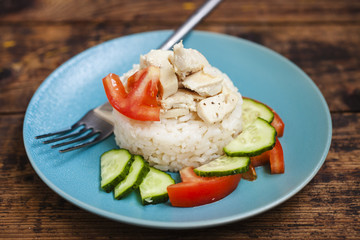 rice with chicken and vegetables in a plate