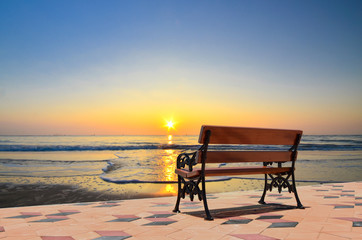 Bench near the beach and clear blue sky