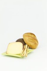Dark and light breads with gouda cheese on white background