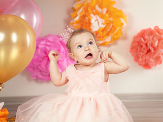  cute baby girl celebrates birthday one year.