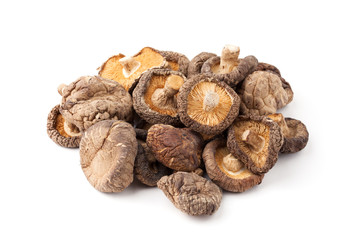 dry shitake mushroom pile on white background