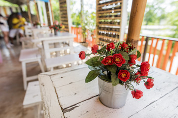 Decoration flower on the table in coffee shop ,Thailand