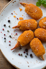 Above view of fried breaded crab claws, close-up, studio shot