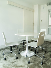 White round table and chairs in meeting room