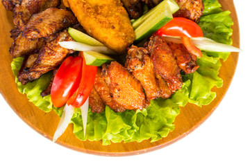 Fried chicken wings with vegetables
