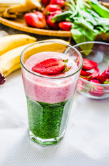 double smoothies, green with spinach, kiwi and banana with straw