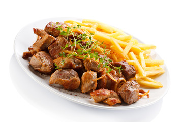 Kebab, chips and vegetables 