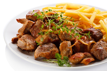 Kebab, chips and vegetables 