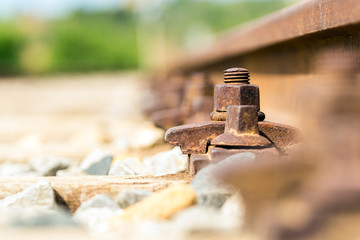 Rusty rail fastening system, low point of view. Italy