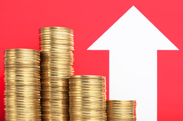 Pile of coins and growing arrow. More money. Increase income.