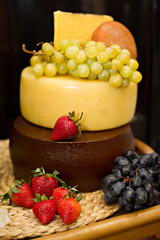 Still life picture with cheese and grape