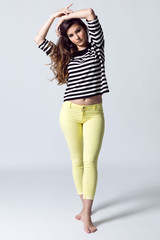 Fashion portrait of pretty young woman posing in the studio photo.