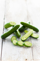 Fresh cucumbers on a wooden background