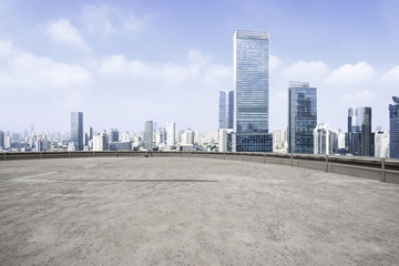 Modern city skyline and empty cement square