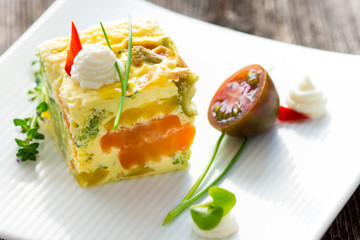 Vegetables pie with fresh herbs on the plate