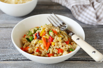 quinoa with slices of vegetables in bowl