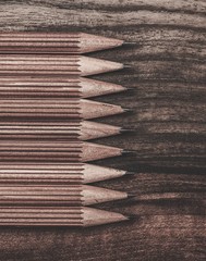 Luxurious charcoal drawing pencils on a wooden table