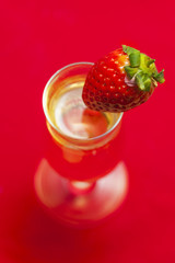Glass of champagne with a strawberry.