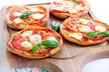 Tomato and mozzarella mini pizzas