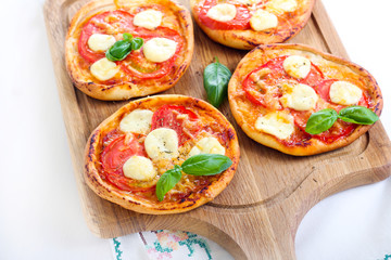 Tomato and mozzarella mini pizzas