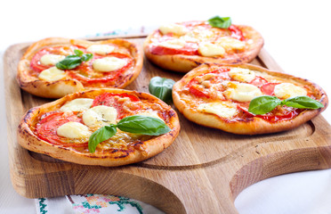 Tomato and mozzarella mini pizzas