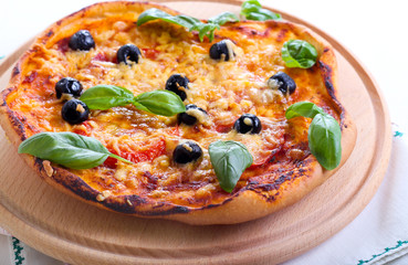 Tomato, basil and olive mini pizza