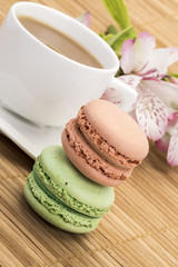 colorful macaroons and coffee on table