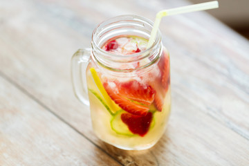 Fototapeta na wymiar close up of fruit water in glass bottle