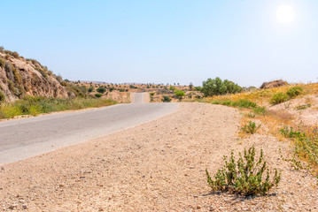 Fototapeta na wymiar Asphalt Road above Grand Crater in Negev Desert