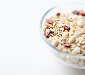close up of bowl with granola or muesli on table