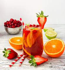 Refreshing summer drink sangria with fruits and berries