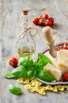 Composition with italian dish ingredients, pasta, parmesan chees