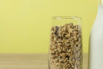 oatmeal flakes in a glassful next to the milk carafe. 
