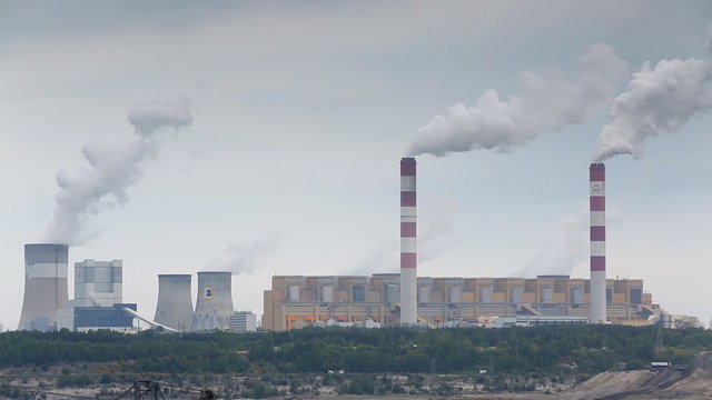 The smoke from the chimneys of power plant