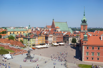 Naklejka premium Old town in Warsaw, Poland. The Royal Castle and Sigismund's Column called Kolumna Zygmunta