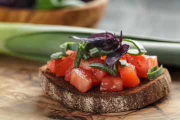 homemade bruschetta with tomatoes, basil and leek