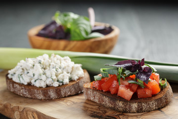 homemade bruschetta with tomatoes, basil and leek