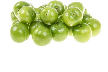 green plums on white