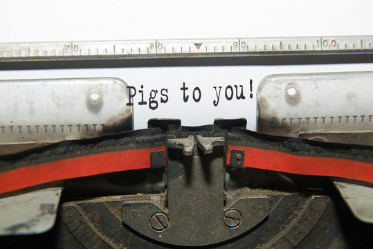 Sheet of paper with the inscription "Pigs to you"
