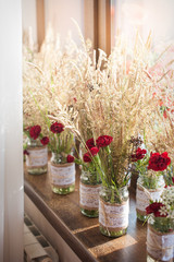 bouquets of flowers in vases on the street