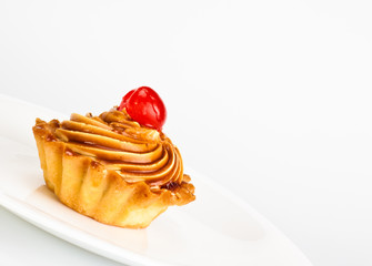 cake with cherry on dish