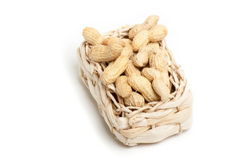 peanuts isolated in basket on white background