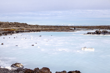 The lagoon is a man-made lagoon which is fed by the water output of the nearby geothermal power plant Svartsengi