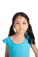 Little asian girl  with bandage on forehead