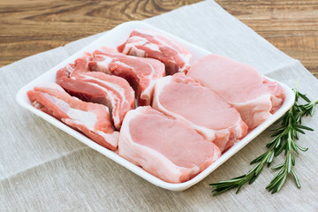 Raw pork meat on wooden desk