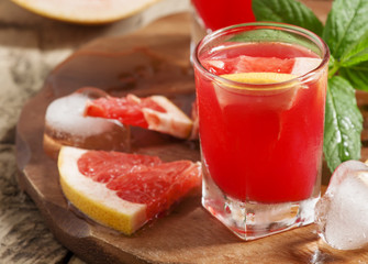 Fresh juice of red grapefruit, selective focus