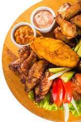Fried chicken wings with vegetables