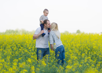 family from three people on a rape field