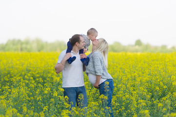 family from three people on a rape field