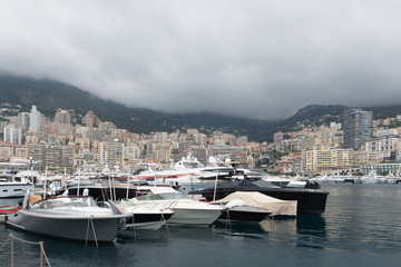 Fototapeta na wymiar Luxury boats shelter from stormy weather in the harbour at Monaco